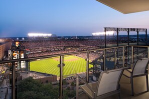 A stadium with a large seating area and a baseball field.