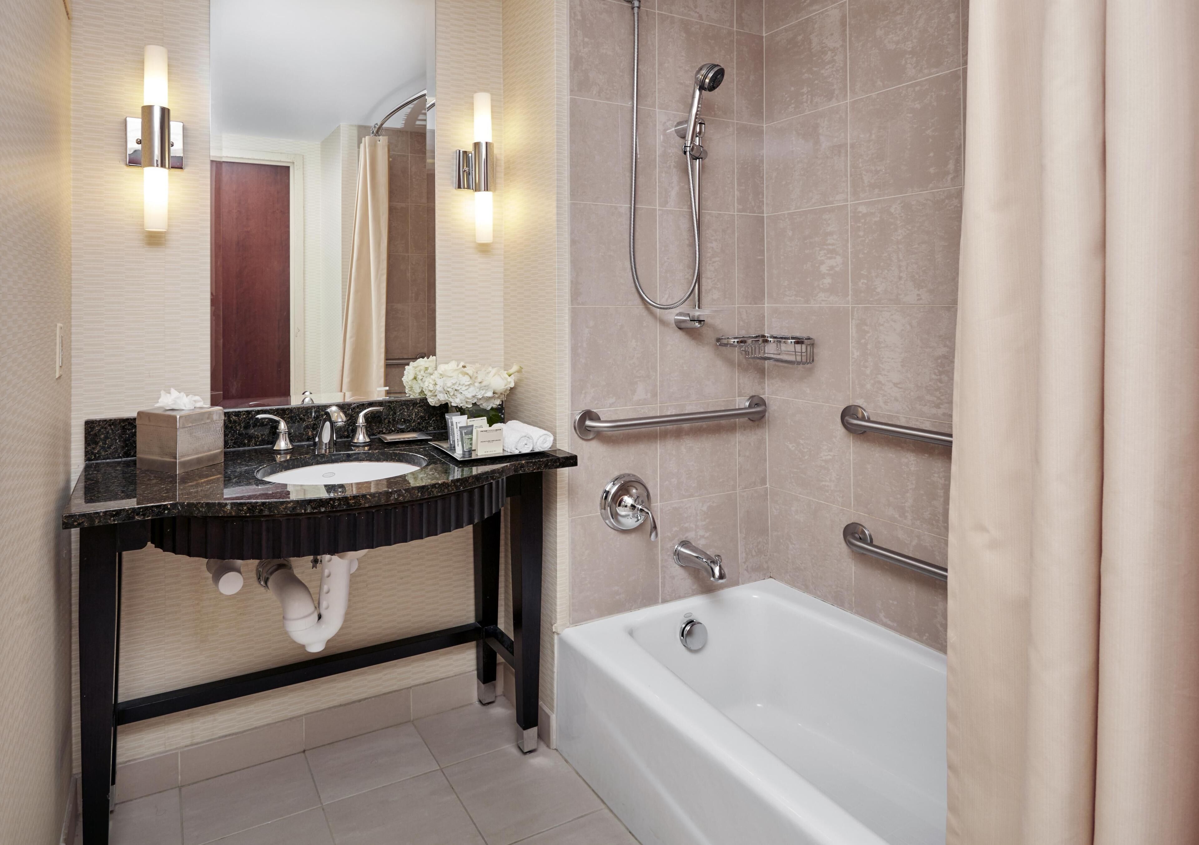 Combined shower/tub, designer toiletries, hair dryer, towels