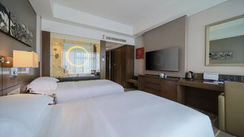 Premium bedding, down comforters, memory foam beds, in-room safe