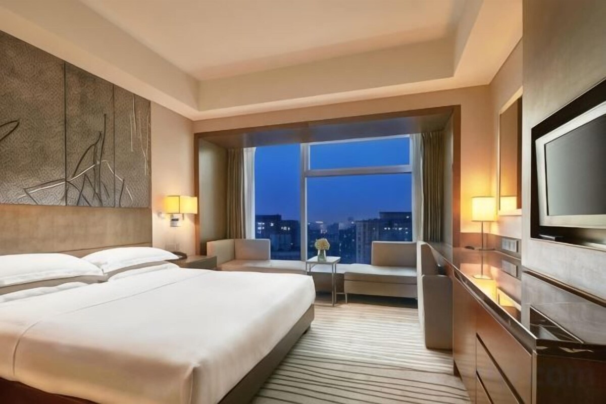 Premium bedding, down duvets, memory-foam beds, in-room safe