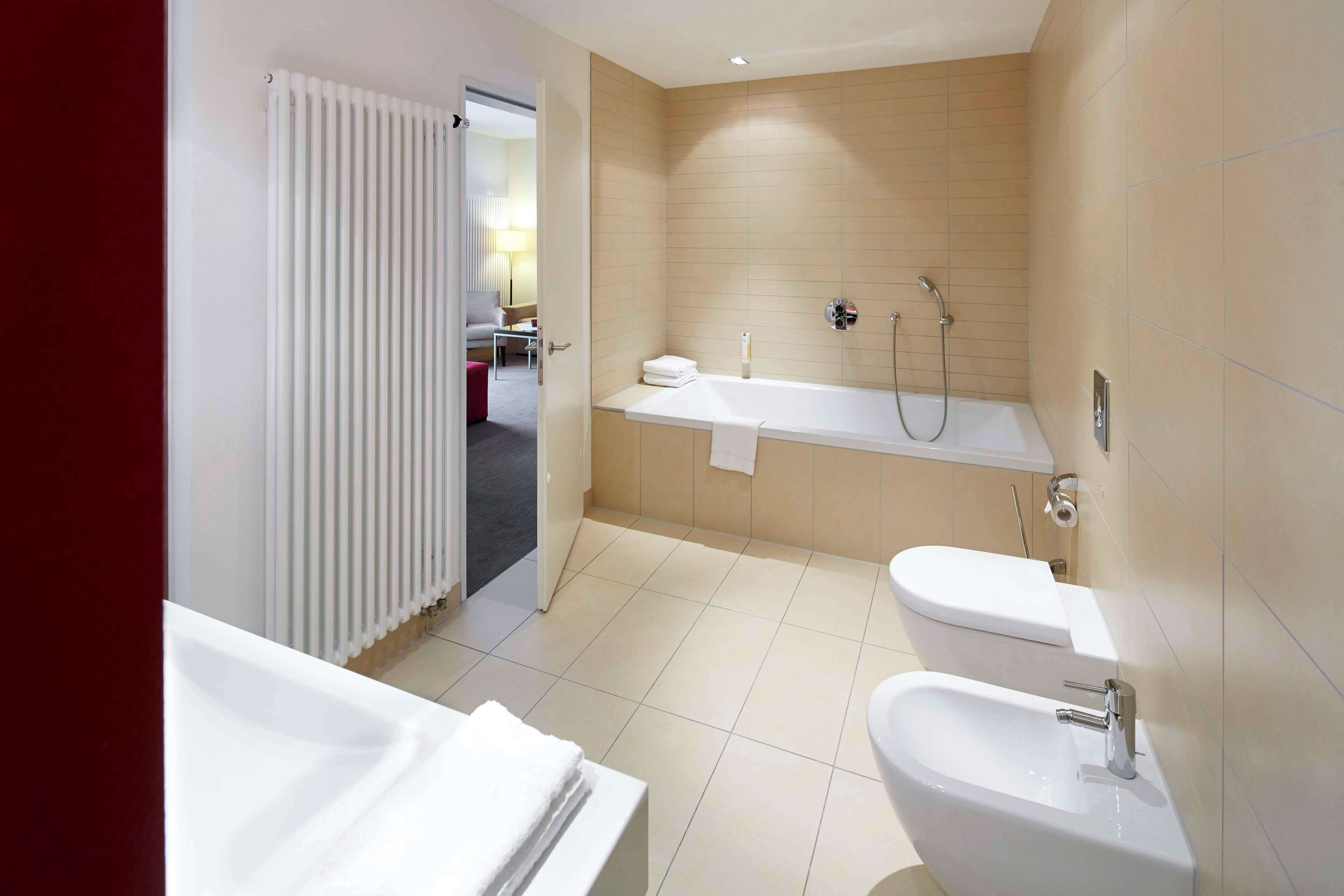 suite, multiple beds (with sofabed) | bathroom | combined shower/bathtub, free toiletries, hair dryer, towels