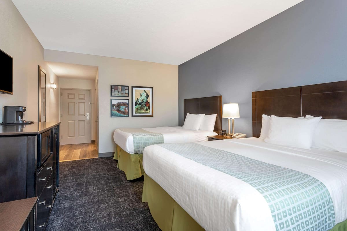 Premium bedding, desk, laptop workspace, iron/ironing board