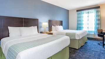 Premium bedding, desk, laptop workspace, iron/ironing board
