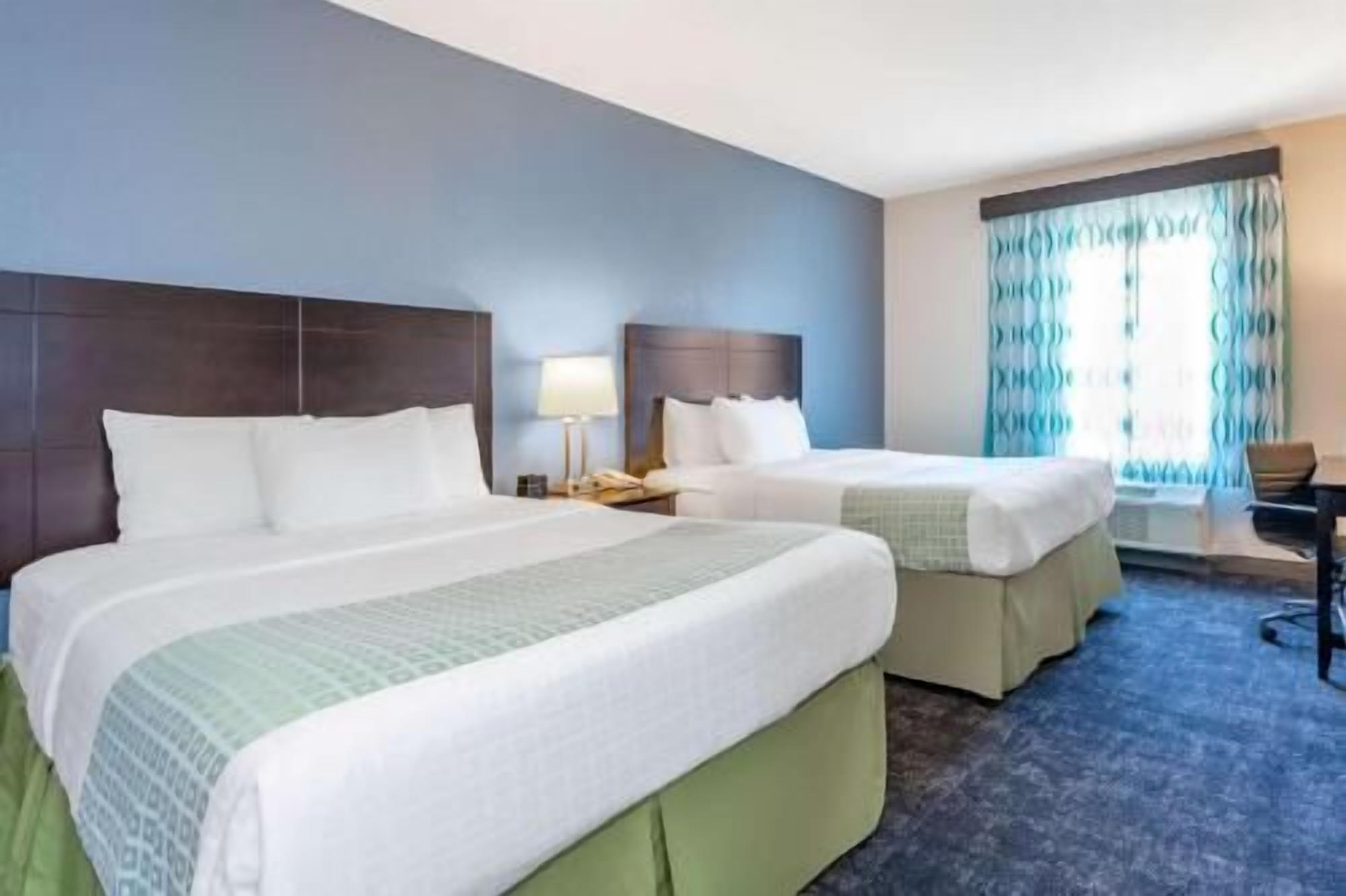 Premium bedding, desk, laptop workspace, iron/ironing board