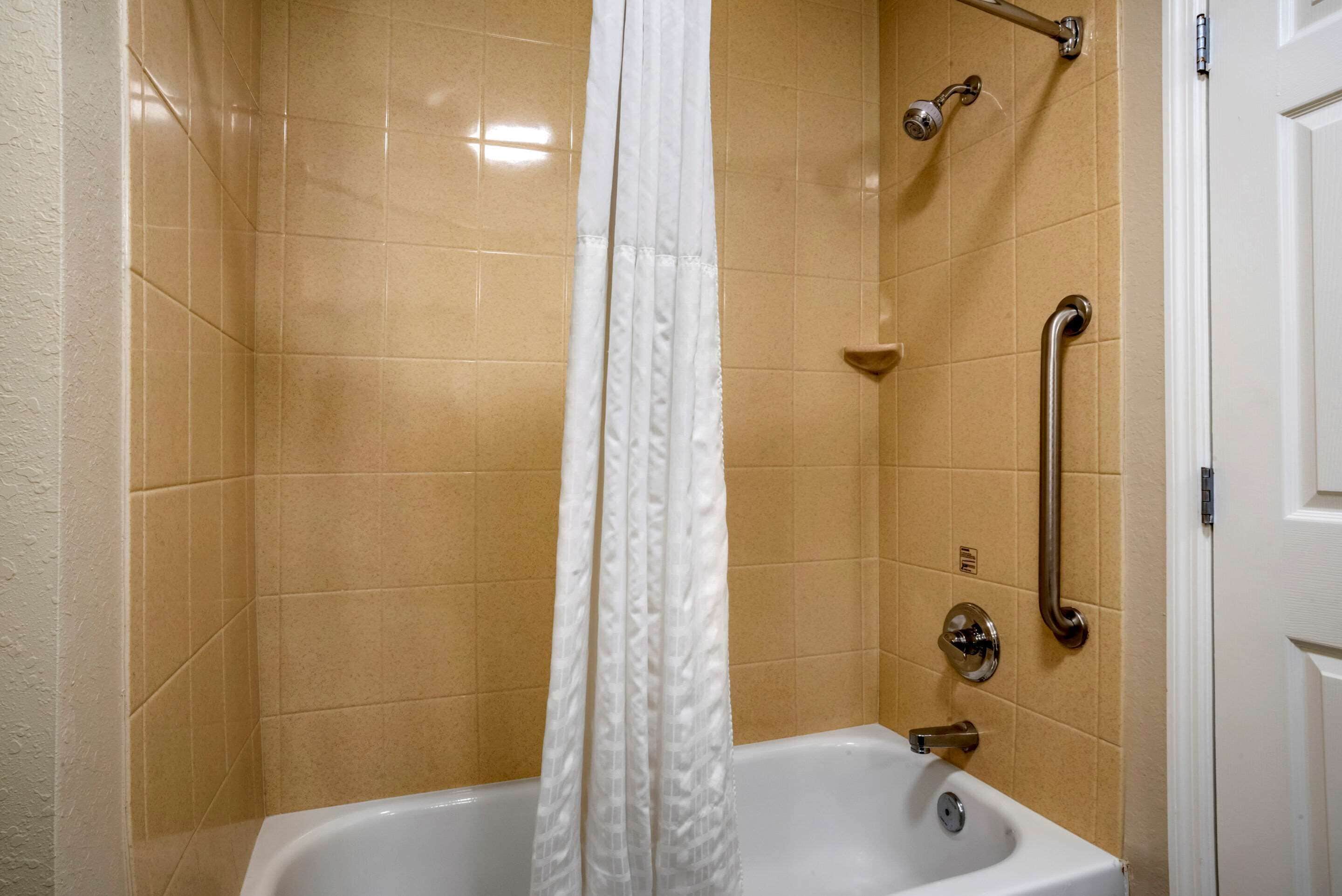suite, 1 king bed, non smoking | bathroom | bathtub, free toiletries, hair dryer, towels
