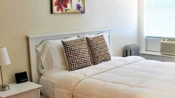 Premium bedding, down comforters, Tempur-Pedic beds, laptop workspace