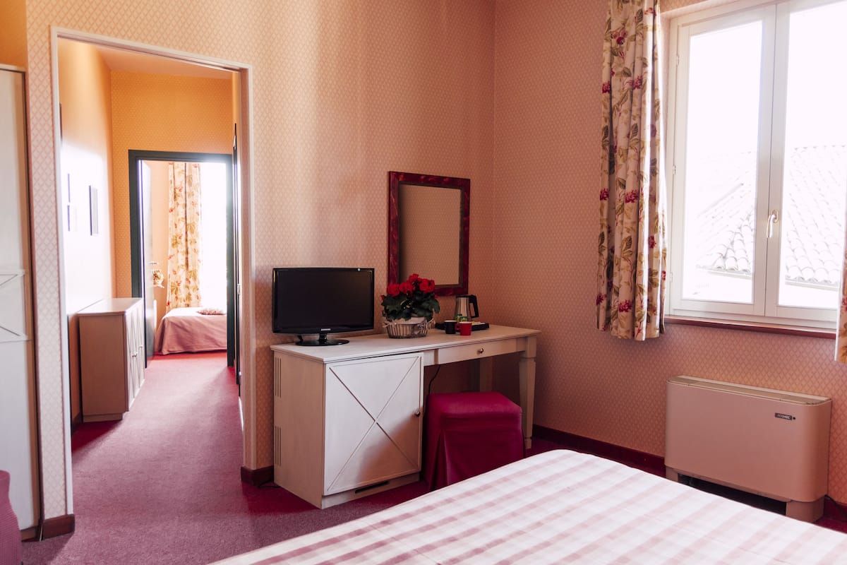 Superior Triple Room, Garden View | 1 bedroom, down comforters, minibar, in-room safe