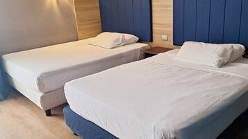 Quadruple Room | Down comforters, in-room safe, desk, soundproofing