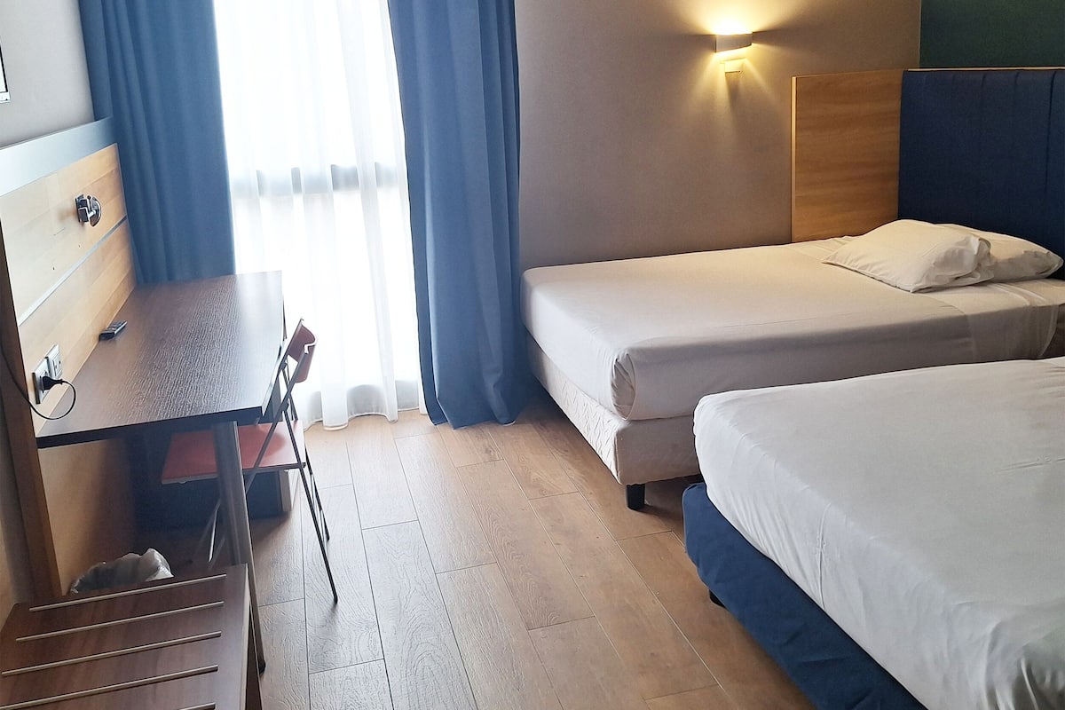 Quadruple Room | Down comforters, minibar, in-room safe, desk