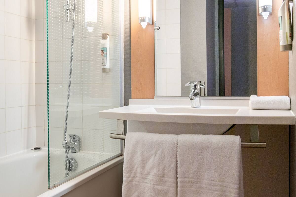 eco-friendly toiletries, hair dryer, towels, soap