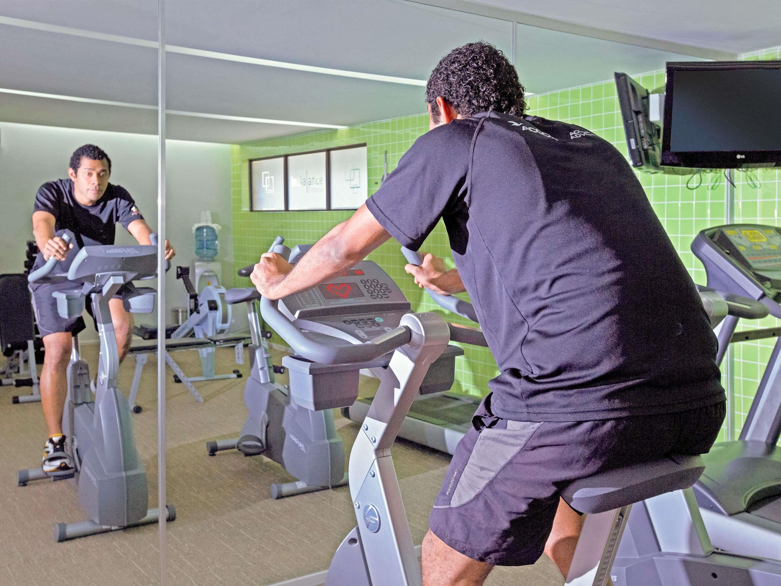 A gym with treadmills and exercise equipment.