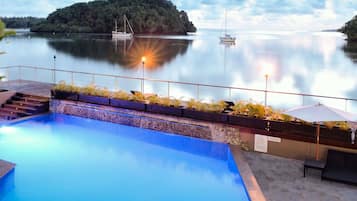 Outdoor pool, pool umbrellas, sun loungers