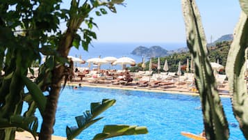 Indoor pool, seasonal outdoor pool, pool umbrellas, pool loungers