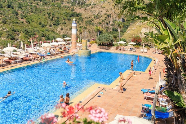 Indoor pool, seasonal outdoor pool, pool umbrellas, sun loungers