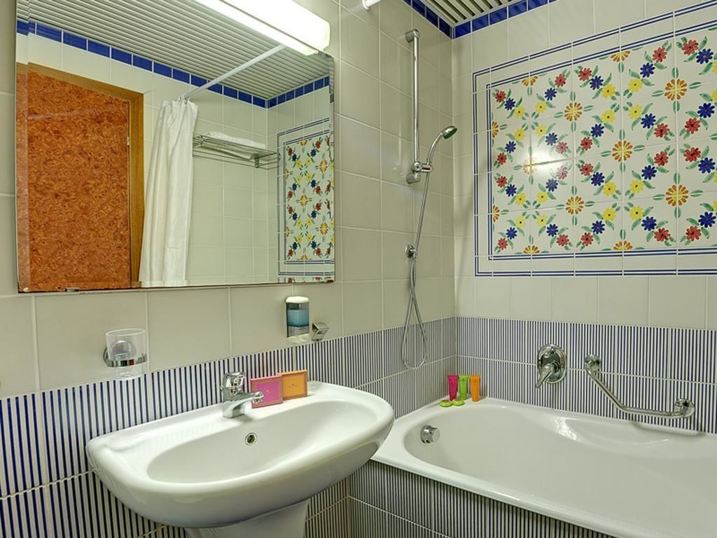 bathtub, hair dryer, bidet, towels