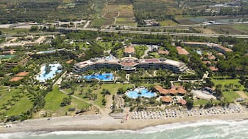 On the beach, sun-loungers, beach umbrellas, beach volleyball