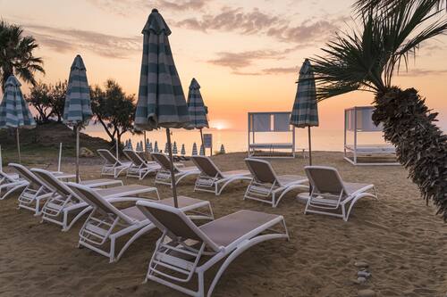 On the beach, sun loungers, beach umbrellas, beach volleyball