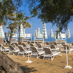 On the beach, sun-loungers, beach umbrellas, beach volleyball