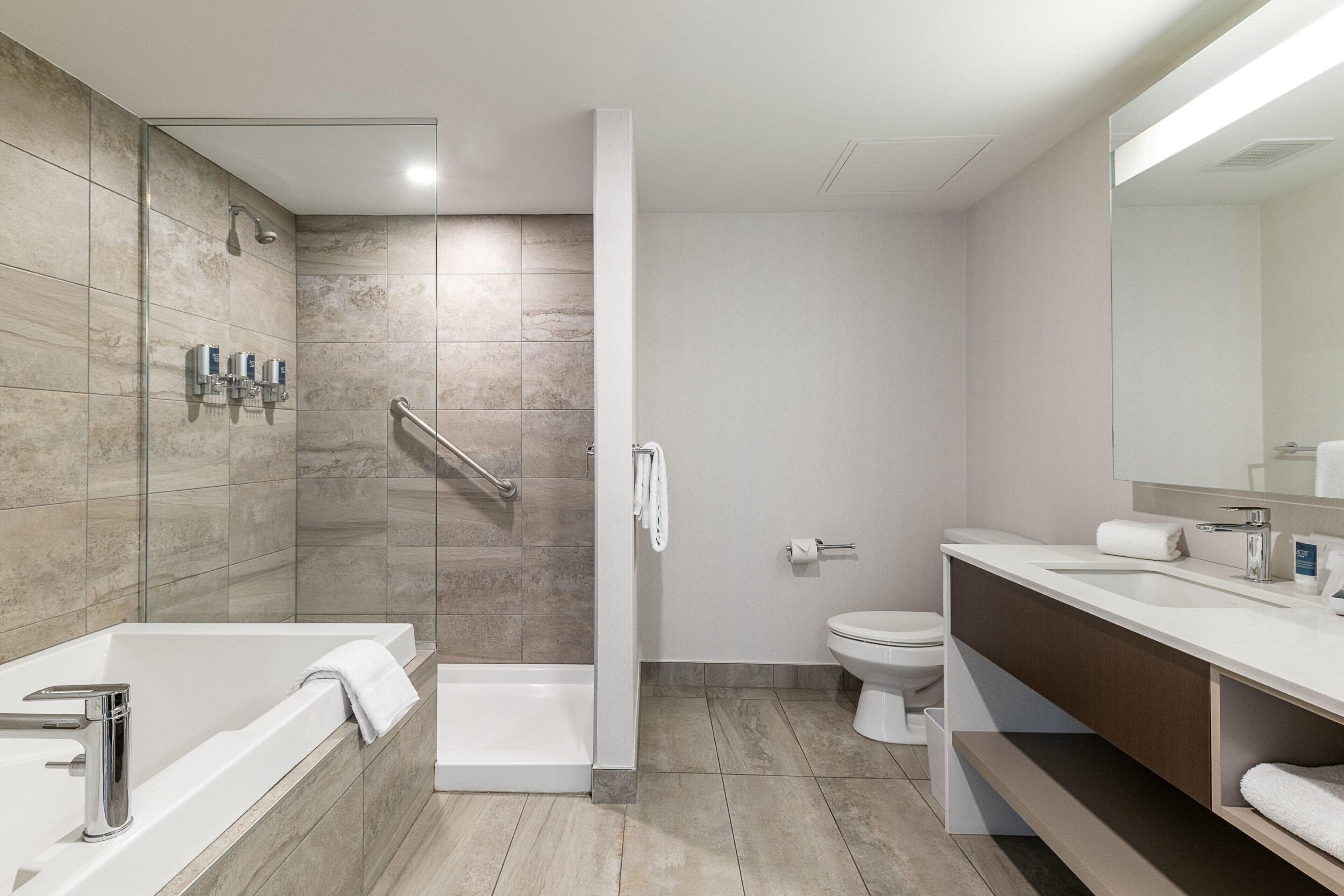 junior suite, 1 king bed with sofa bed | bathroom | free toiletries, hair dryer, towels