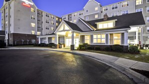 A Marriott hotel with a modern design, featuring a central entrance with a covered walkway, multiple floors, and a parking lot in front. - Residence Inn by Marriott Gulfport-Biloxi Airport (Gulfport)