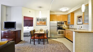 Desk, laptop workspace, blackout curtains, iron/ironing board