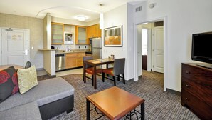 A compact living space with a kitchenette, a dining area, a sofa, and a TV. - Residence Inn by Marriott Gulfport-Biloxi Airport (Gulfport)