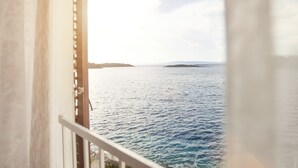 A view from a balcony overlooking a body of water with distant landforms. - Hotel Odisej (Mljet)