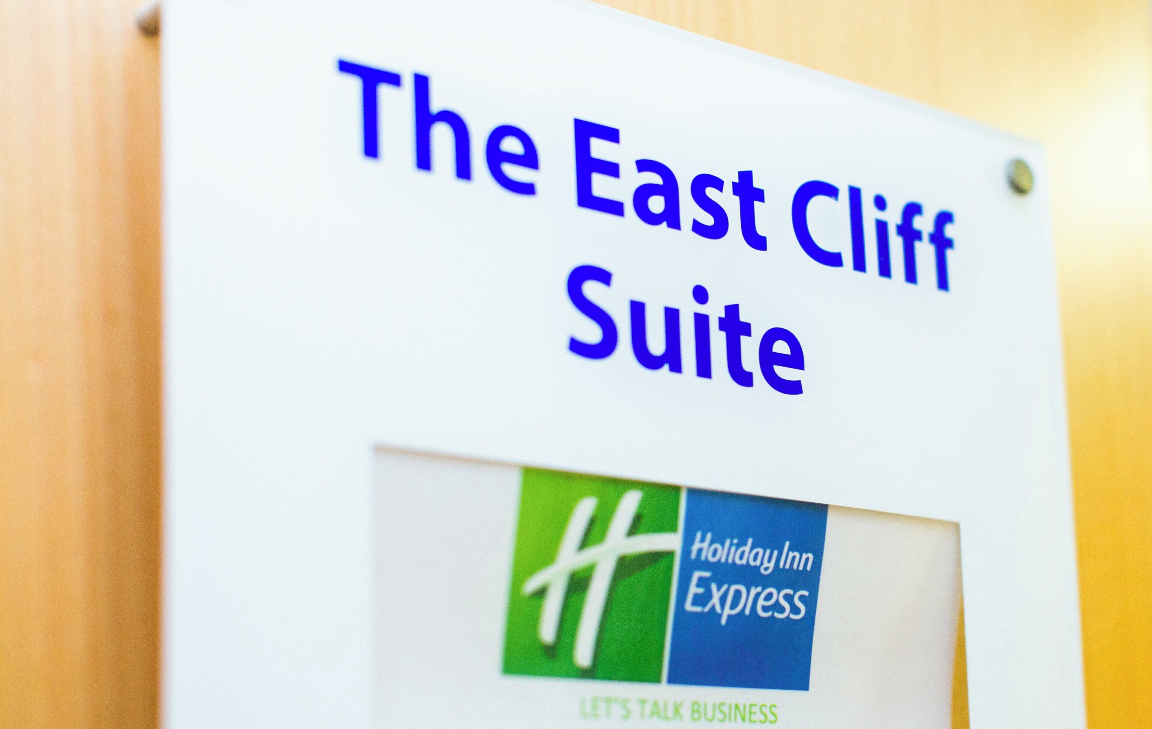A sign for 'The East Cliff Suite' at Holiday Inn Express.