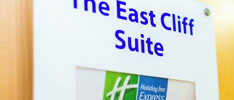 A sign for 'The East Cliff Suite' at Holiday Inn Express.