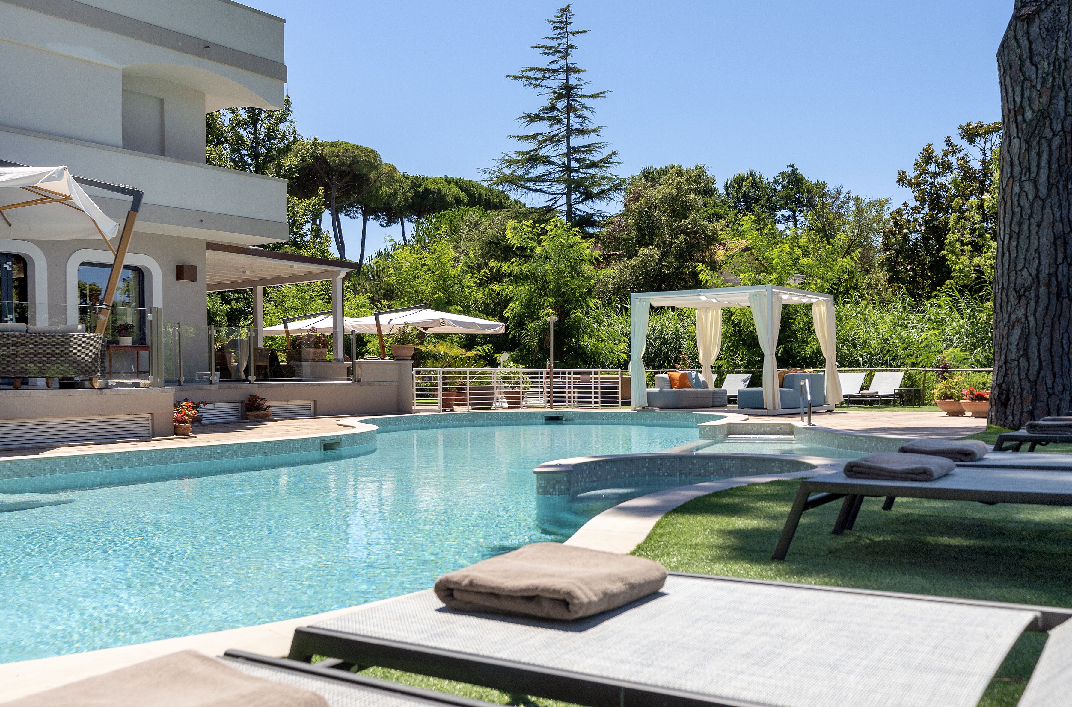 outdoor pool, pool umbrellas, pool loungers