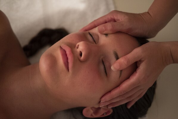 A person lying down with their head resting on a pillow. - Picciolo Etna Golf Resort & Spa, Curio Collection by Hilton (Castiglione di Sicilia)