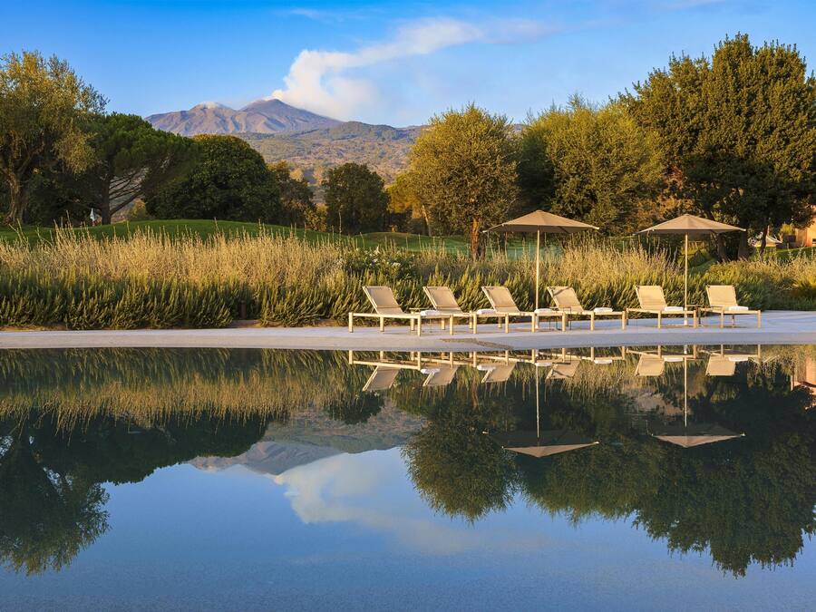 Seasonal outdoor pool, pool umbrellas, pool loungers