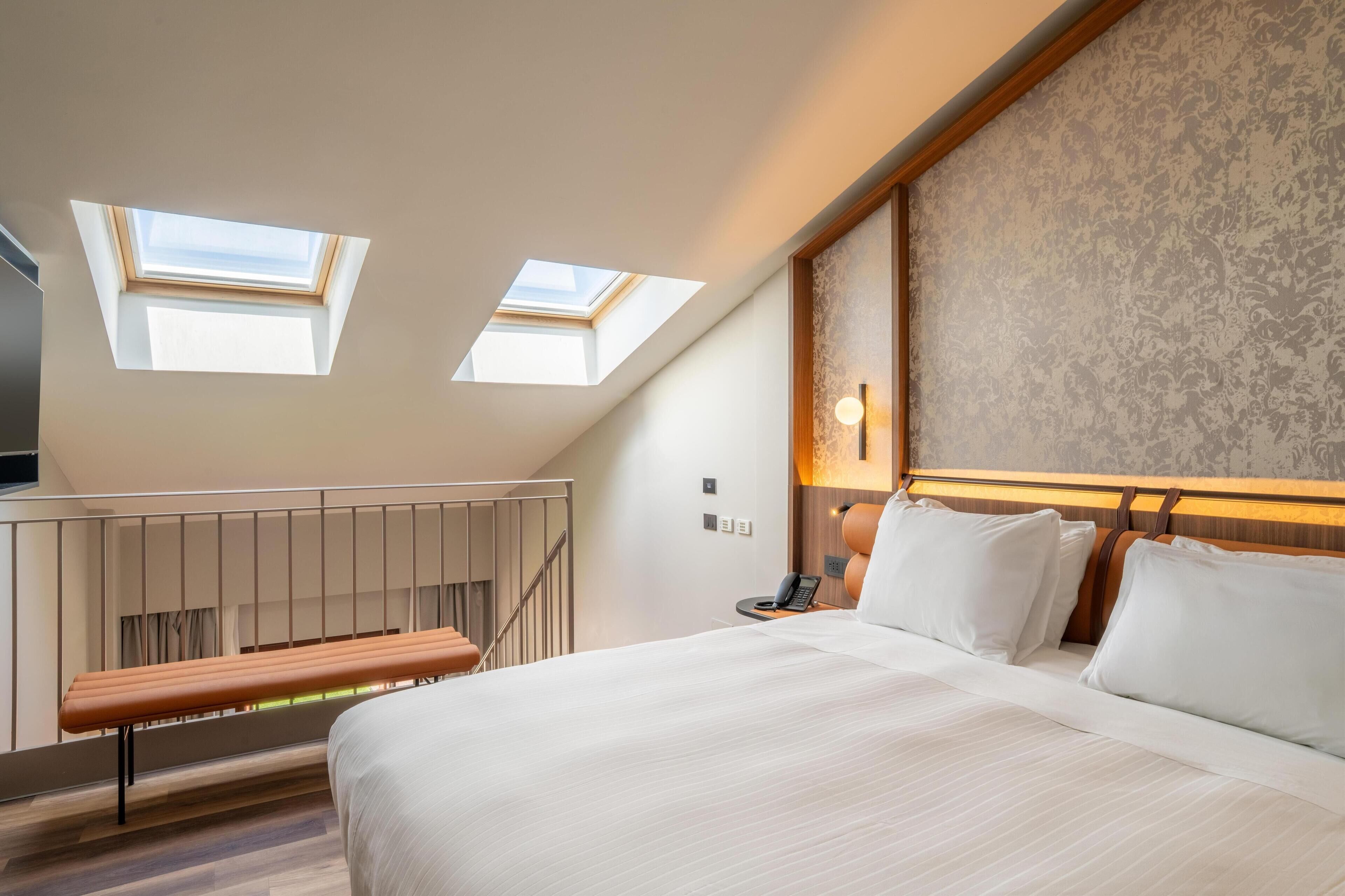 Duplex, 1 très grand lit | Literie de qualité, minibar, coffre-fort, bureau