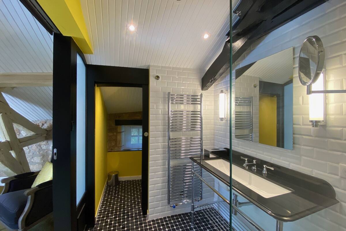 designer toiletries, hair dryer, bathrobes, towels