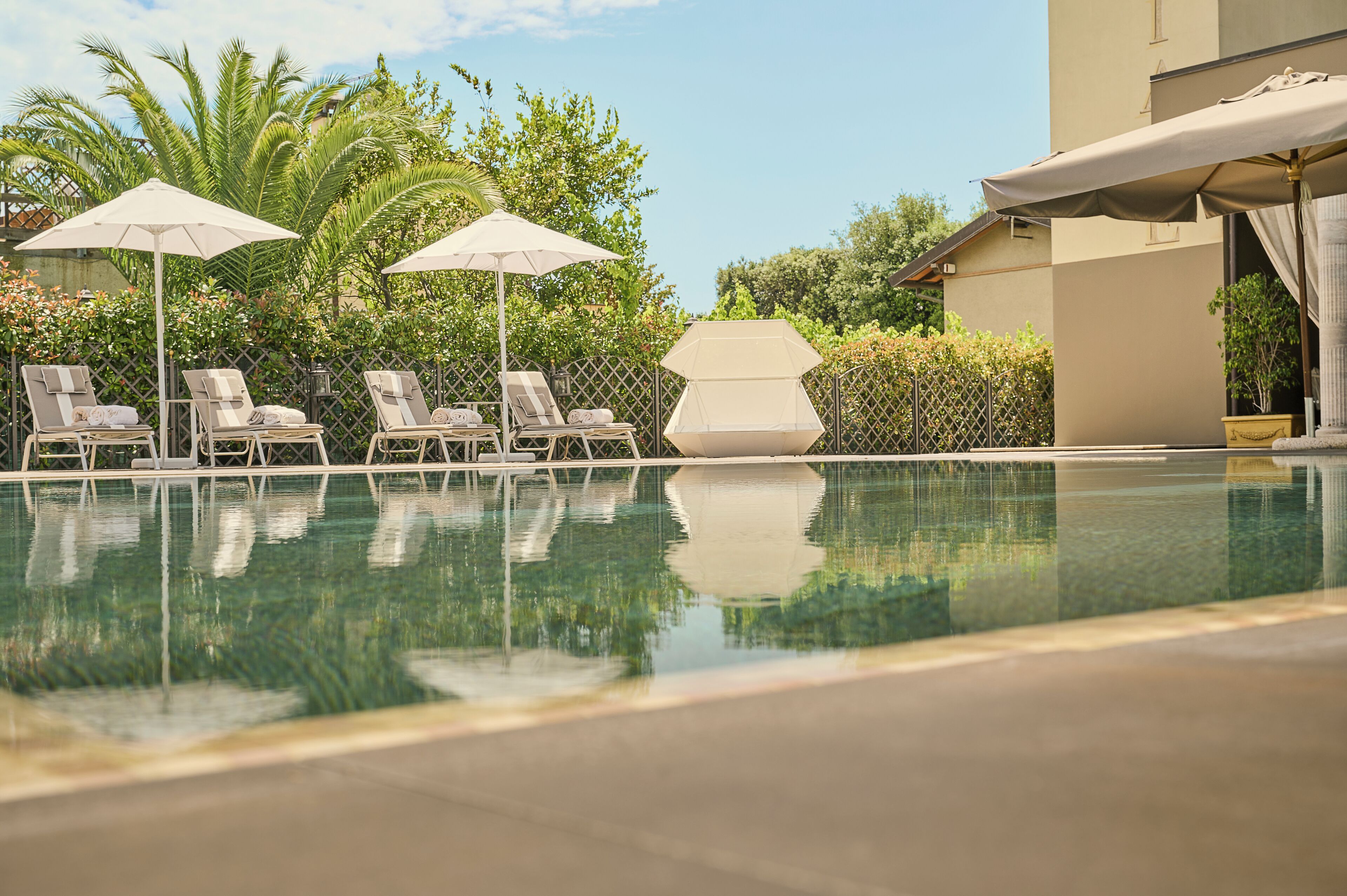 indoor pool, outdoor pool, pool umbrellas, pool loungers