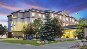 A hotel with a sign reading "CANALTA HOTEL" and a well-lit entrance. - Canalta Hotel High River (High River)