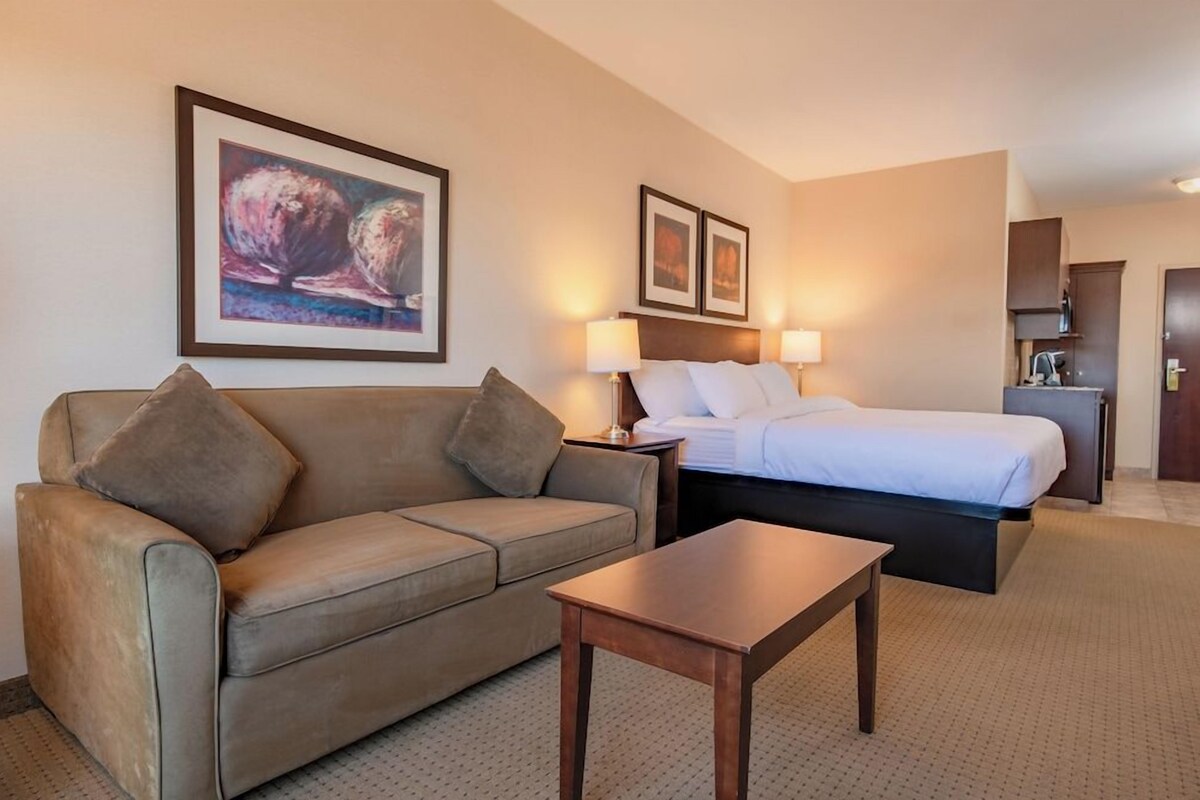 Premium bedding, desk, laptop workspace, iron/ironing board
