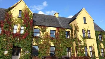 A building with ivy-covered walls and a traditional architectural style.