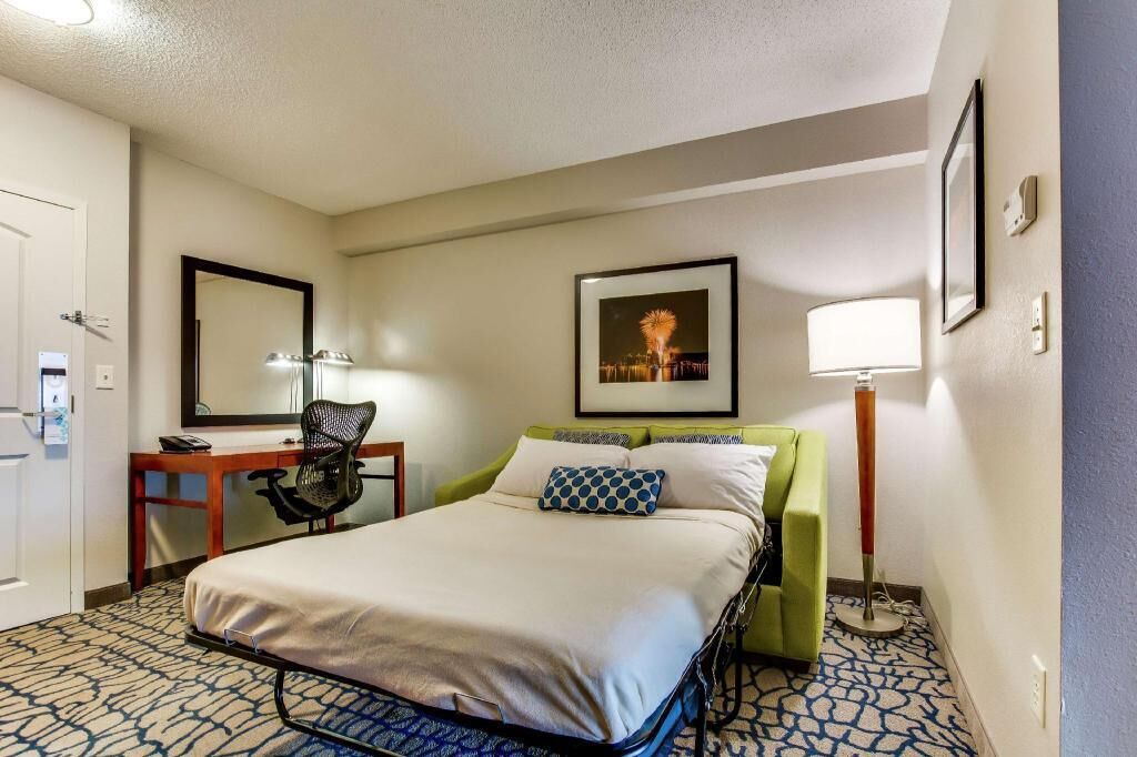 Premium bedding, desk, laptop workspace, iron/ironing board