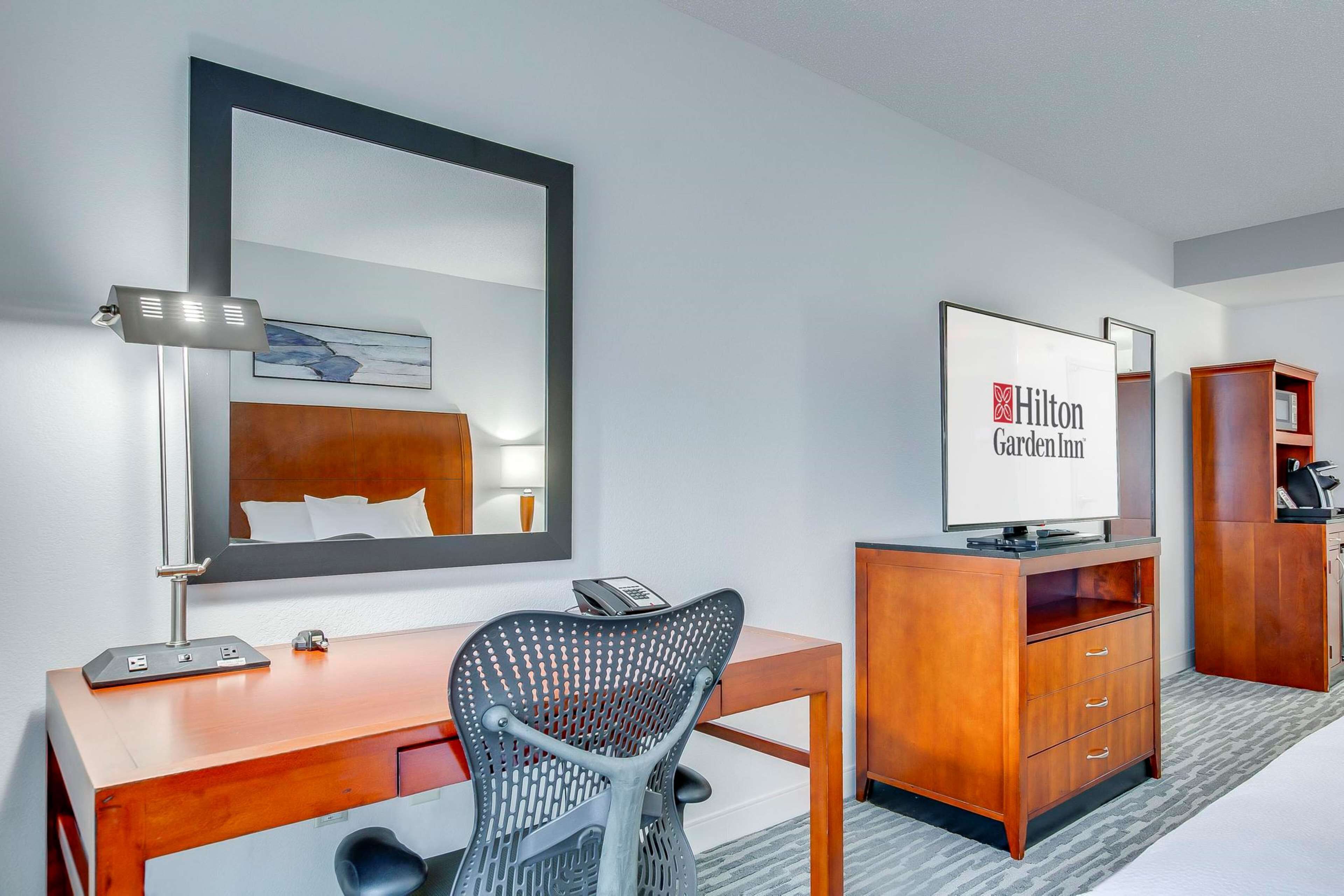 two queens evolution room | premium bedding, desk, laptop workspace, iron/ironing board