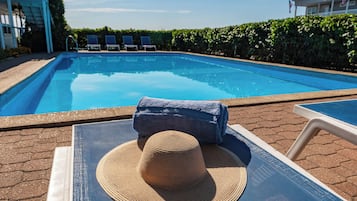 Seasonal outdoor pool, open 9 AM to 9 PM, sun loungers