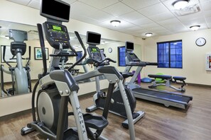 A gym with treadmills, elliptical machines, and exercise equipment. - Staybridge Suites Lansing - Okemos by IHG (Okemos)