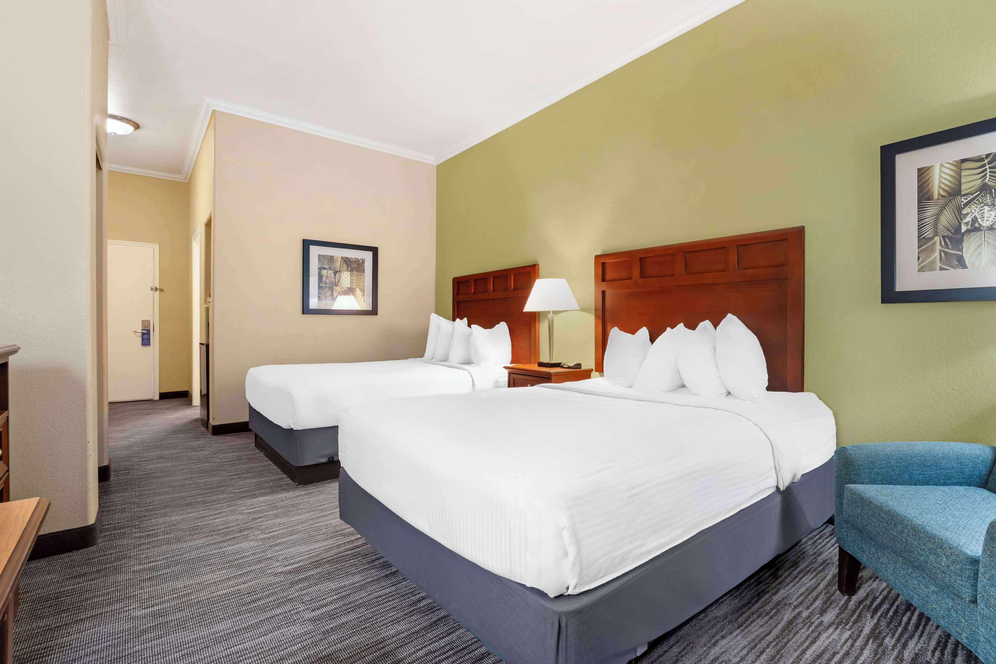 standard room, 2 queen beds, non smoking, refrigerator & microwave | iron/ironing board, free wifi, bed sheets