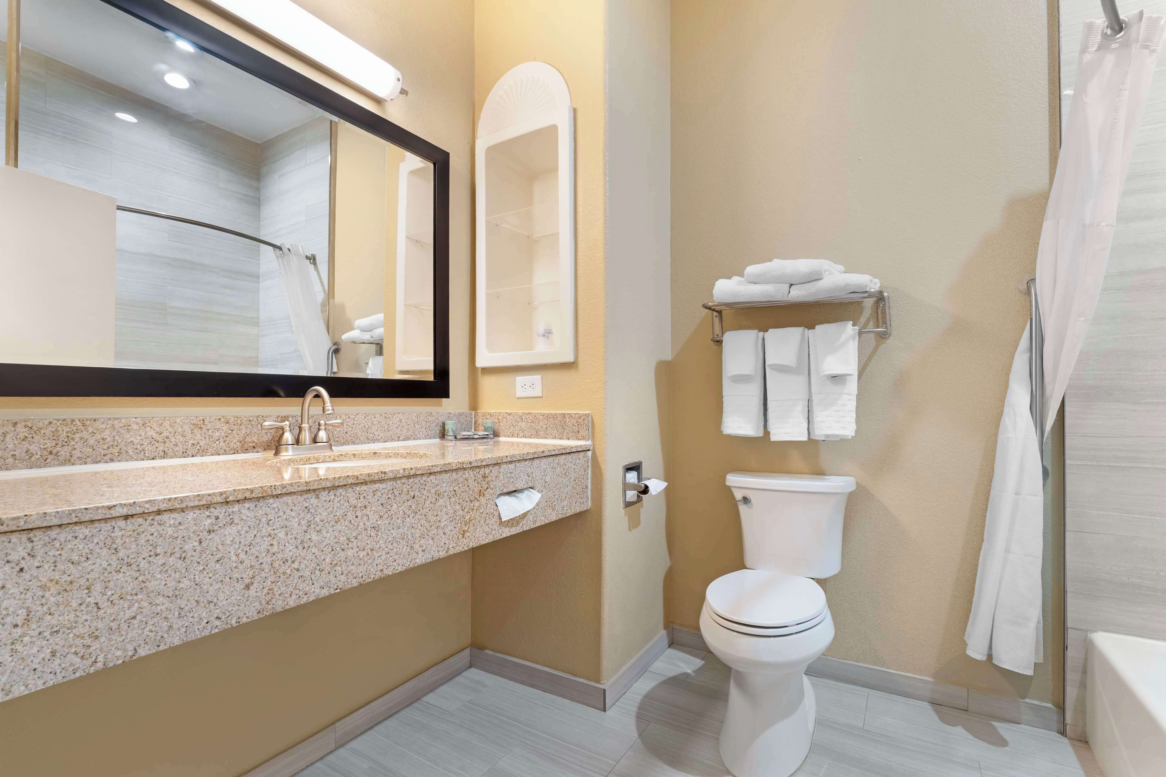 standard room, 2 queen beds, non smoking, refrigerator & microwave | bathroom | free toiletries, hair dryer, towels, toilet paper