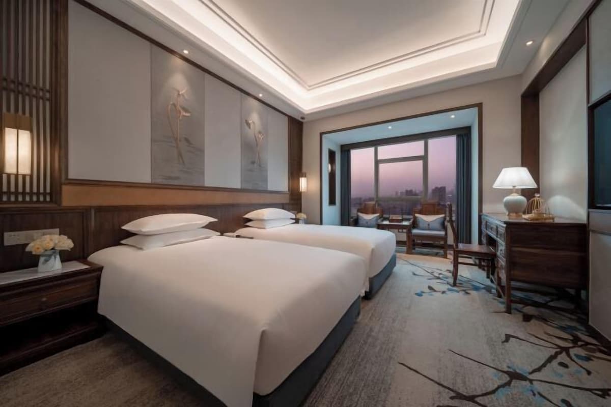 Premium bedding, down duvets, blackout curtains, free WiFi
