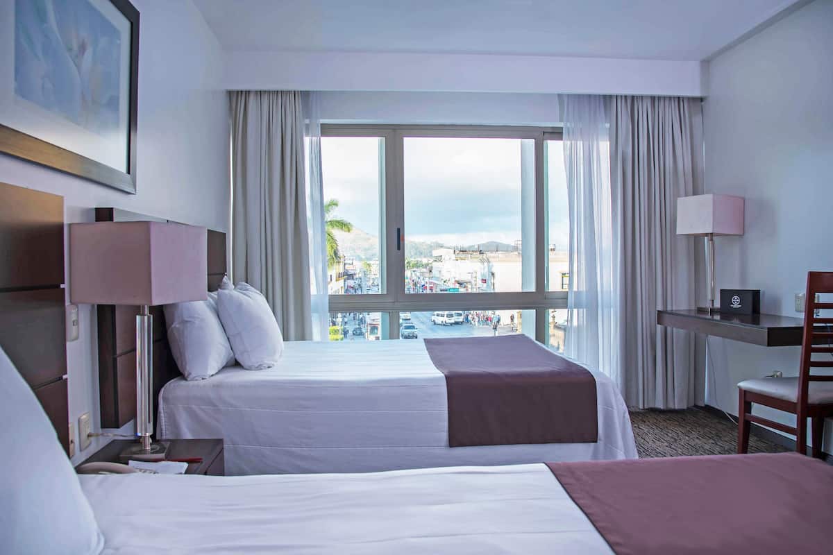 standard room, 2 double beds | premium bedding, down duvets, pillow-top beds, in-room safe