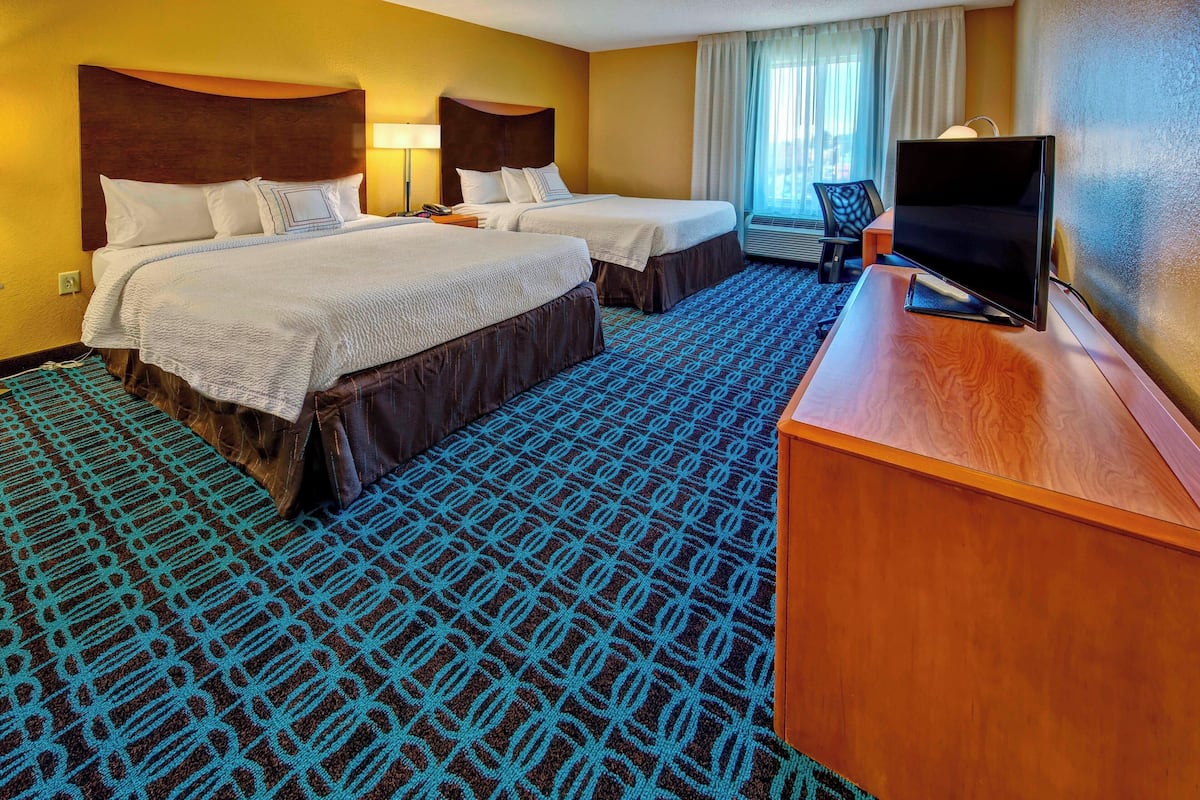Premium bedding, desk, laptop workspace, iron/ironing board