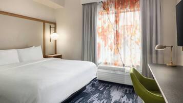 Premium bedding, desk, laptop workspace, iron/ironing board