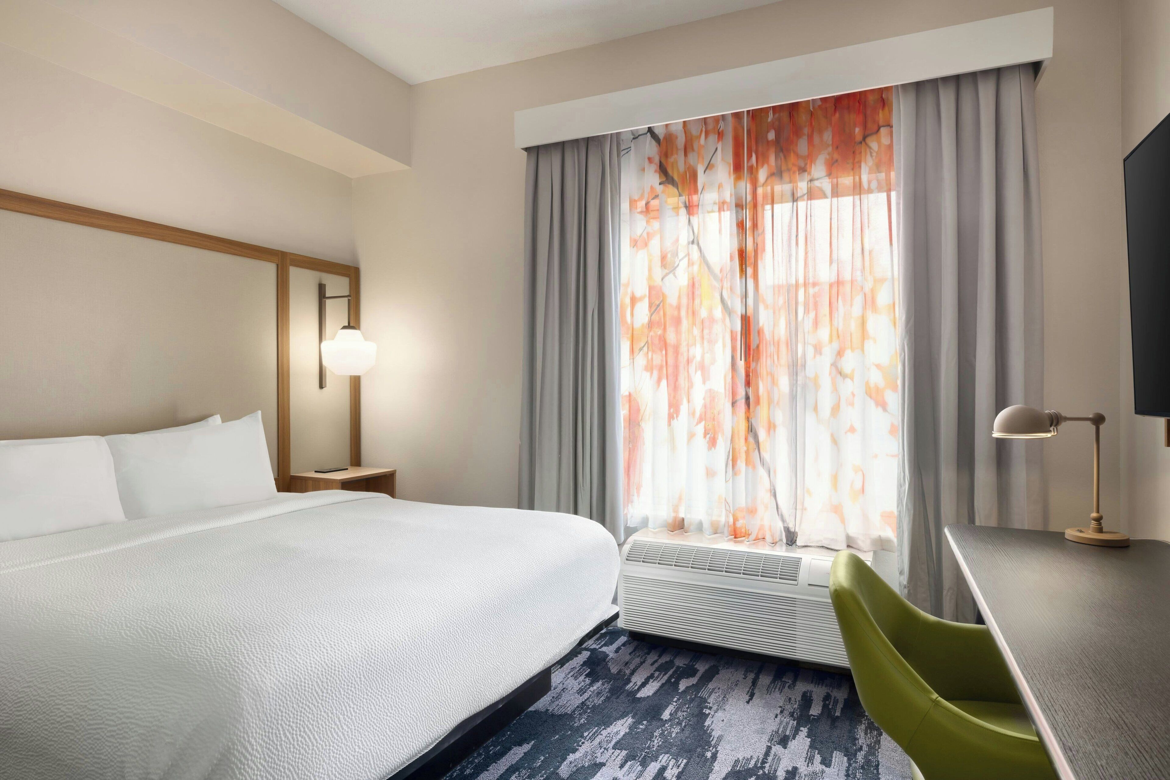 Premium bedding, desk, laptop workspace, iron/ironing board