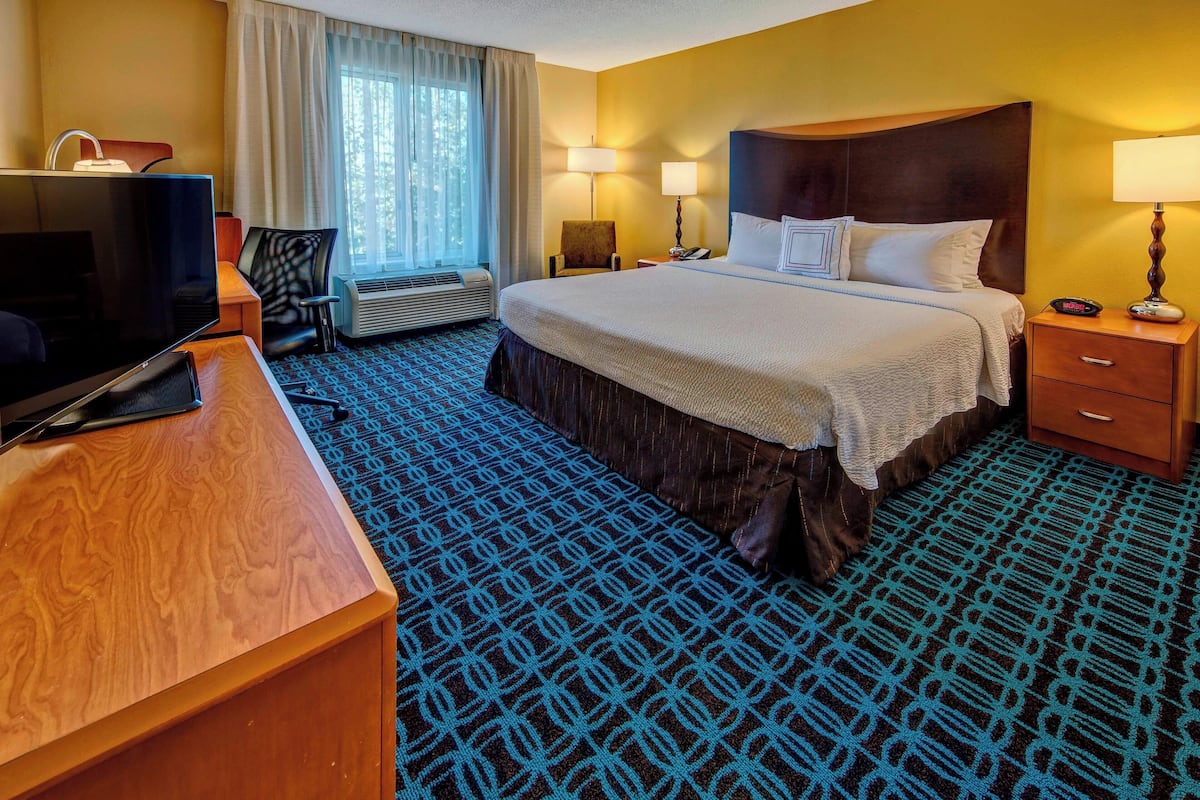 Premium bedding, desk, laptop workspace, iron/ironing board